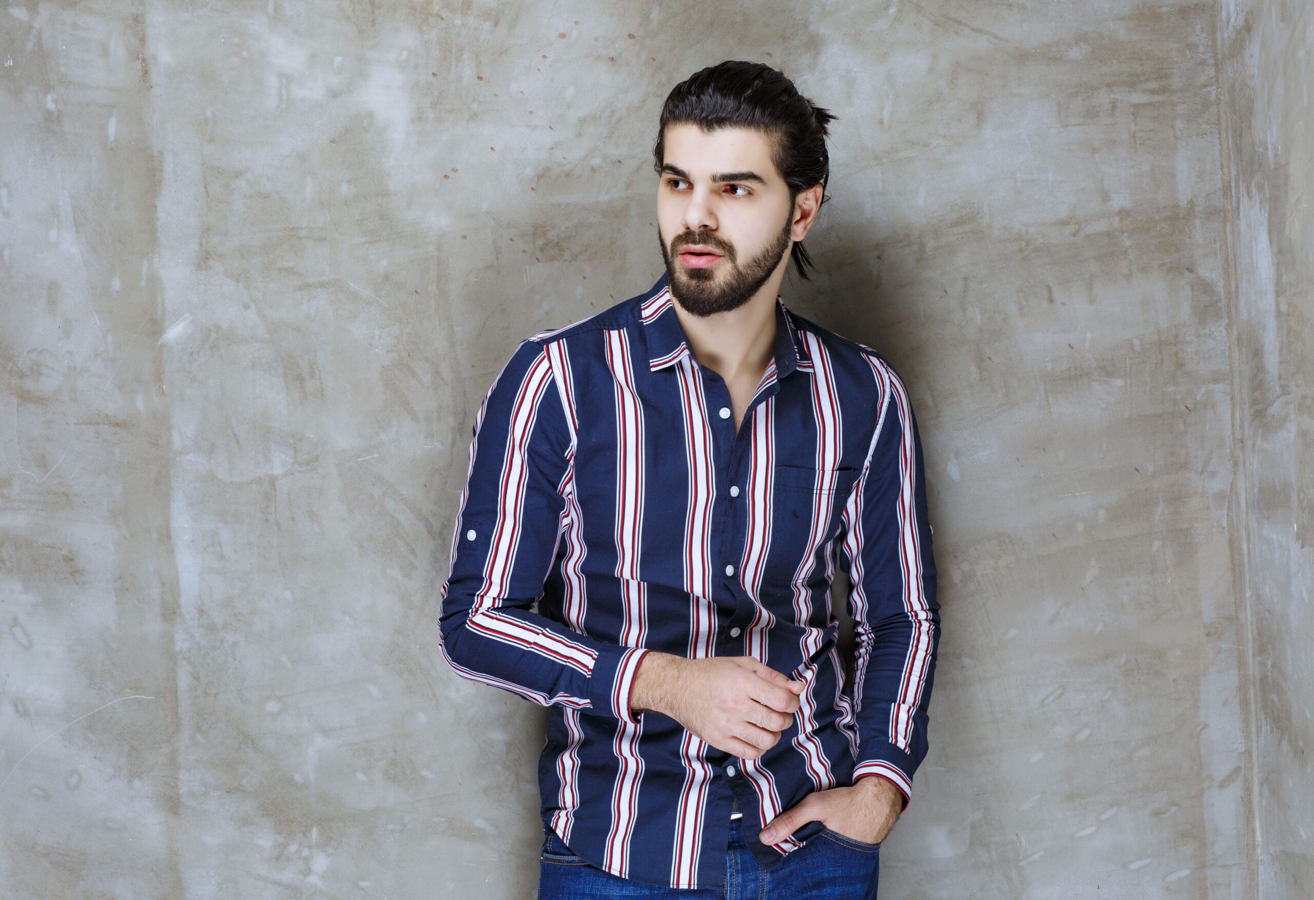 man-striped-shirt-looks-confused-thoughtful-min